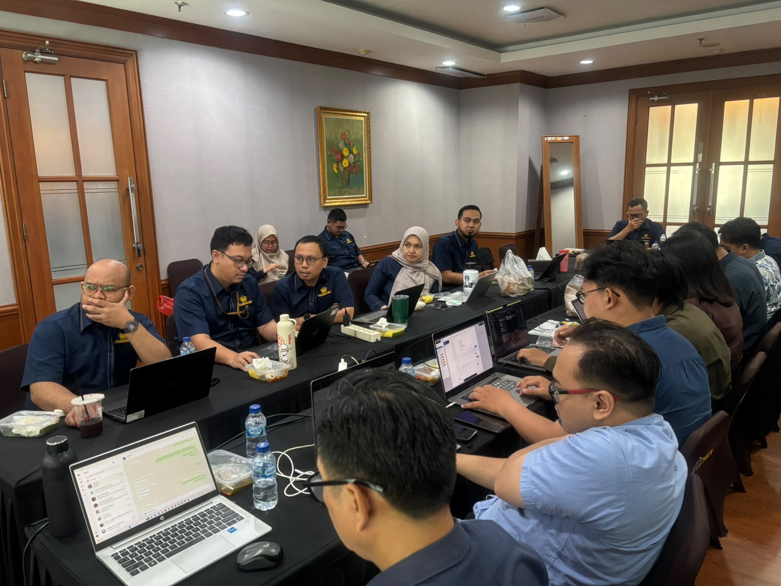 Auction platform team working together in a meeting room