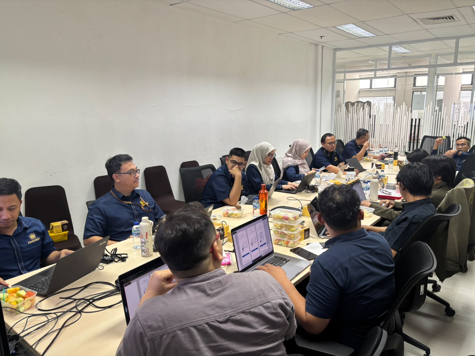 Development team collaborating around a meeting table