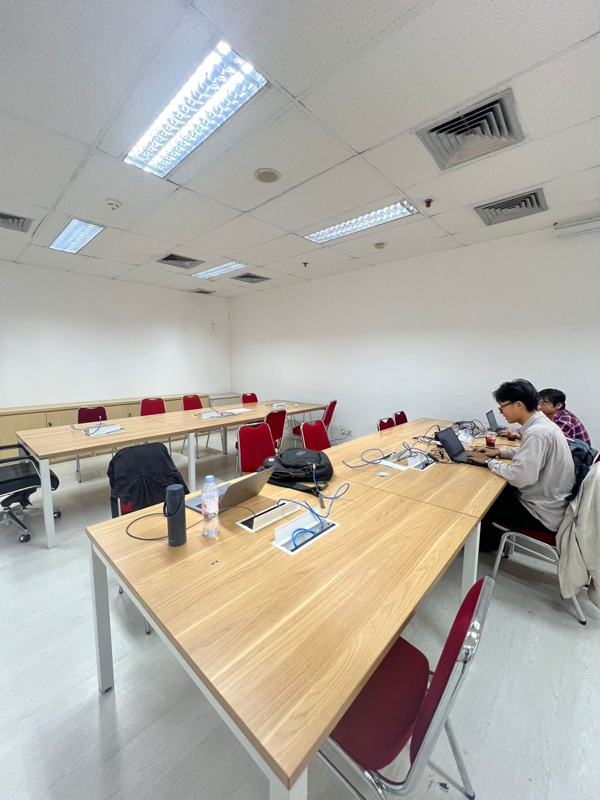 Small development team working late in a meeting room